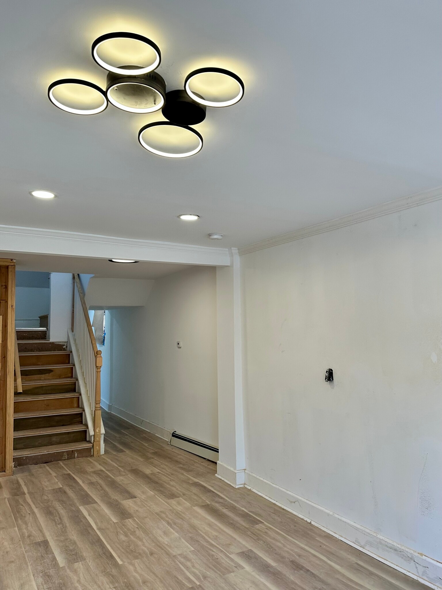 Interior staircase from the living room leading to the private bedroom level. - 328 High St