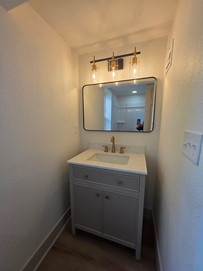 Building Photo - Studio Apartment with bathroom, kitchen & utility area on the lower level of property.