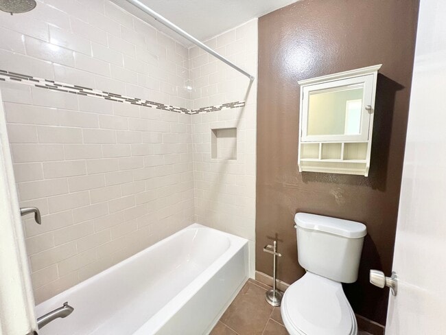 Building Photo - Contemporary 2 Bed Condo with 2 Garage Parking Spaces, Community Pool, and 3 Private Balconies