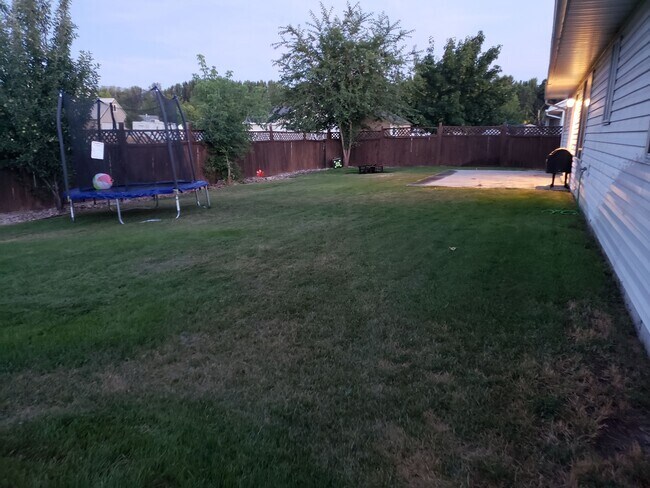 Backyard- it currently has a new white vinyl fence - 482 N 2580 W