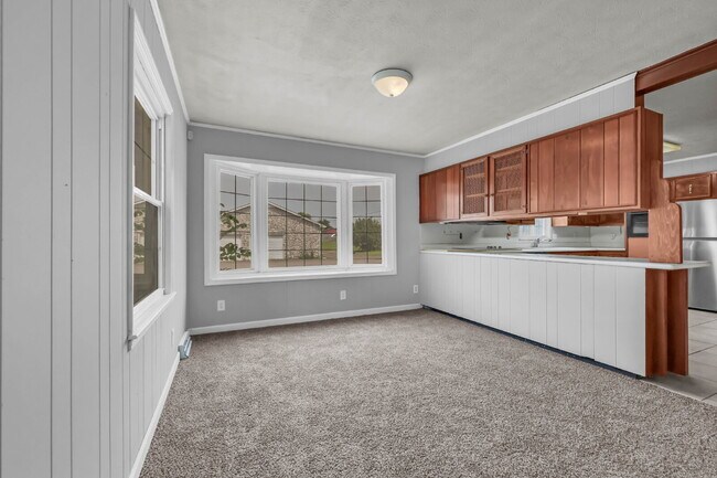 Building Photo - spacious 4-bedroom, 2.5-bath home featuring a 2-car garage and fresh updates throughout.
