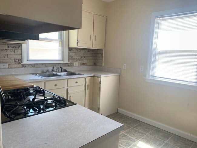 Building Photo - Three bedroom home with beautiful hardwood floors and central air!