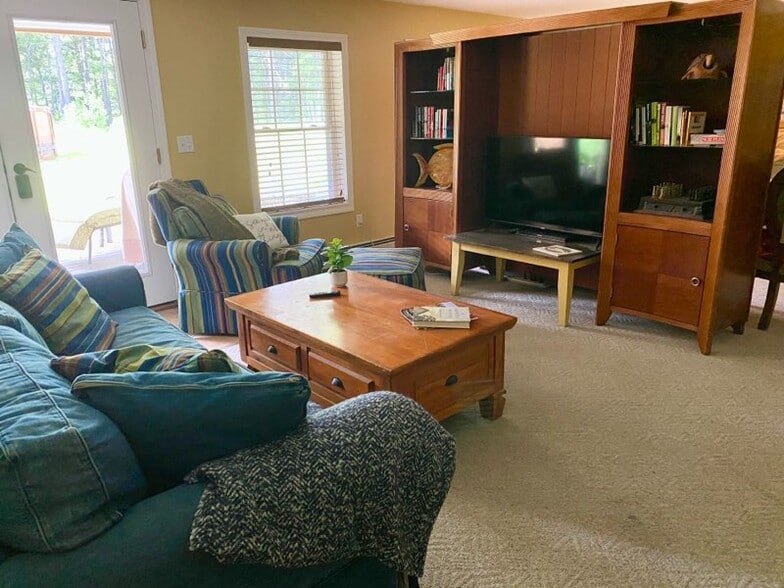Livingroom with entertainment center - 60 Milliken Mills Rd