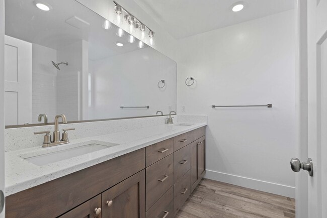 Building Photo - NEW HOME with large garage stalls and unfinished basement for additional storage