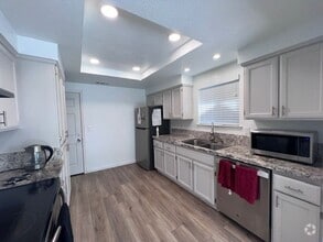 Building Photo - Updated kitchen, laminate floors throughou...