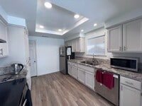 Building Photo - Updated kitchen, laminate floors throughou...