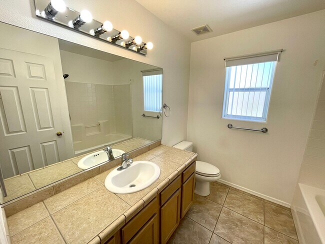 Building Photo - Inviting 3 Bedroom Home with RV Parking an...