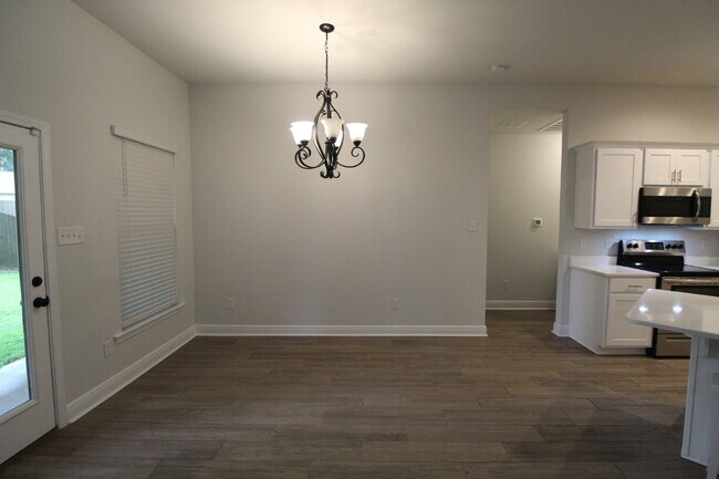 Building Photo - Sweetbarb Estates 3BR Home Near I-10 & Pine Forest Rd with Quartz Kitchen, LVP Flooring, 2-Car Ga...