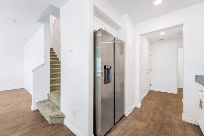 Building Photo - Modern Mosaic Townhome with Stylish Finishes & Resort-Style Community Amenities!