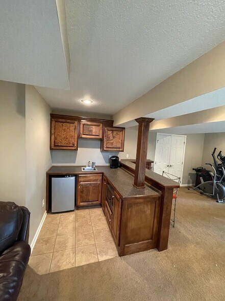Wet bar with Small Refrigerator and Microwave - 13846 W 154th Ter