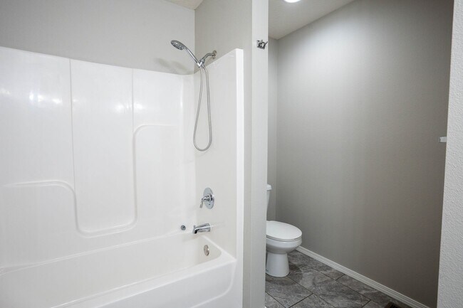 Building Photo - 3 bed home with NEW FLOORING AND FULLY FEN...