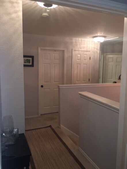 Hall way facing Bed 2, then bathroom hall bath, then bed 3 and bed 4. Behind camera is master bedroom. - 3809 Willie Mays Ln