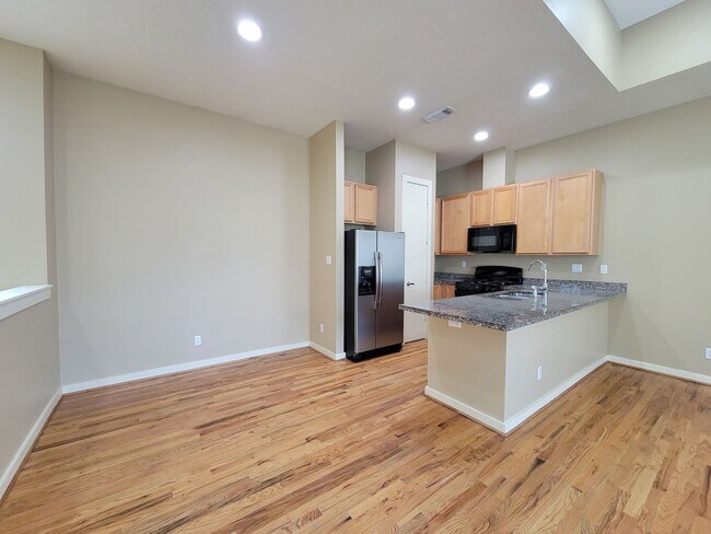 Building Photo - Elegant Gated Townhome Offering Unparallel...