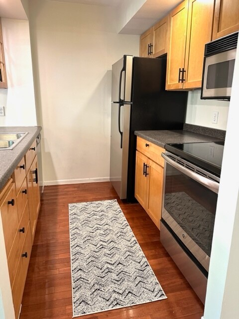 Updated custom cabinets and newer stainless steel appliances - 334 W 5th St