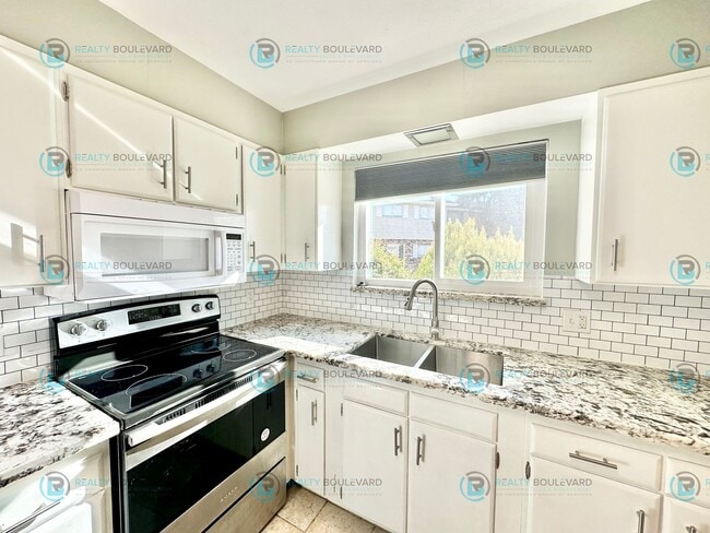 Building Photo - 2-bed, 2-bath, 2-story townhome with pool and park like setting outside the front door.