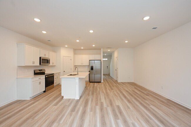 Building Photo - **BE THE LUCKY ONE TO LIVE IN THIS 2024-BUILT BRICK TOWNHOME IN THE VILLAS AT REGAL SQUARE FEATUR...