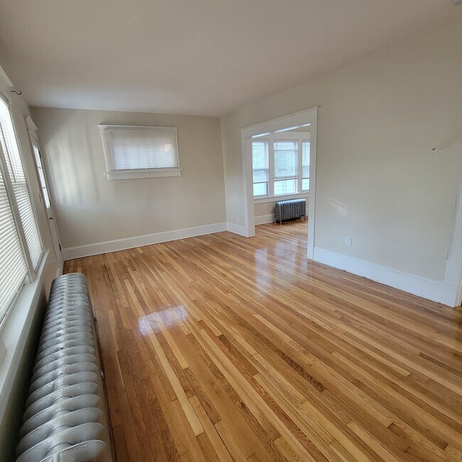 Large Living Room with refinished flooring - 633 Park Ave