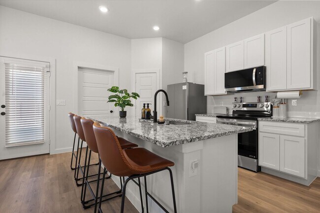 Building Photo - Four Beds, All Appliances, All Smiles!