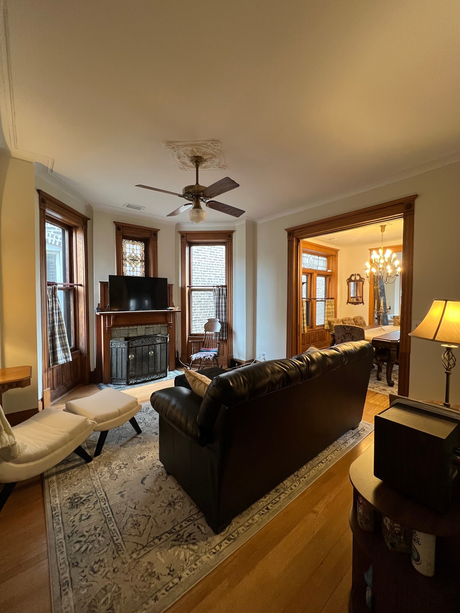 Second living room with leather furniture, looking into dining room - 938 W Newport Ave