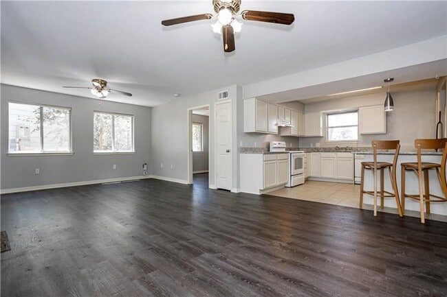 Building Photo - Stunning Renovation - New Hardwood flooring, tile in Kitchen. Granite countertops, breakfast bar