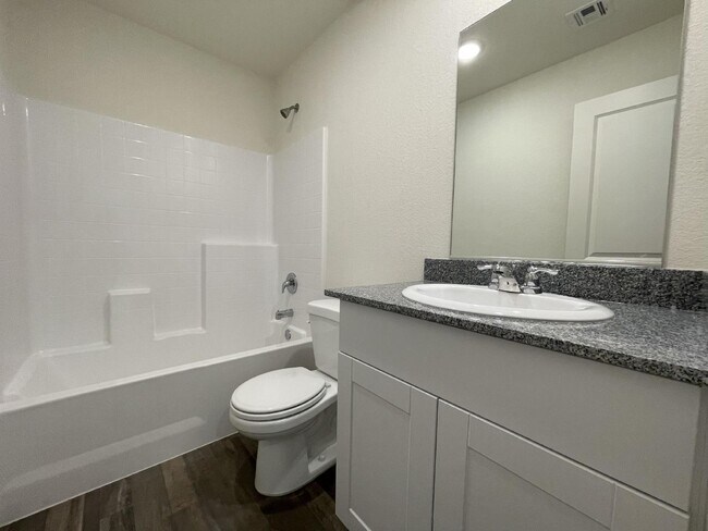 Building Photo - $1,675 rent - Home in gated community with...