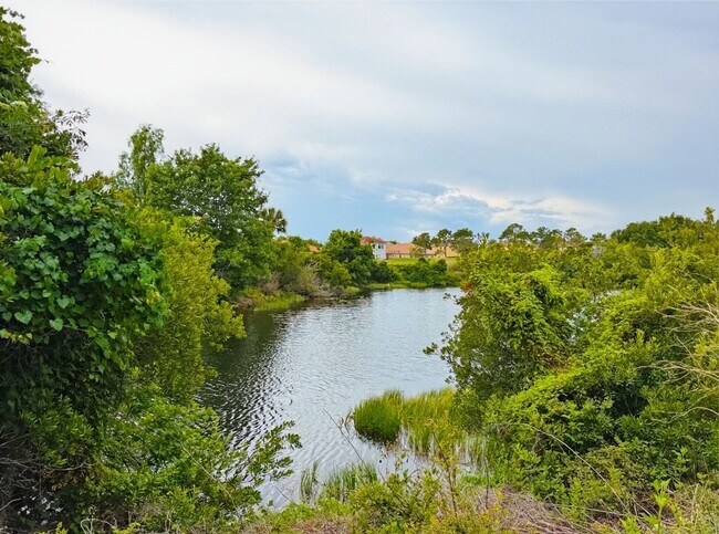 Building Photo - Waterfront 4 Bedroom Home in Eagle Creek Golf Community – Lake Nona