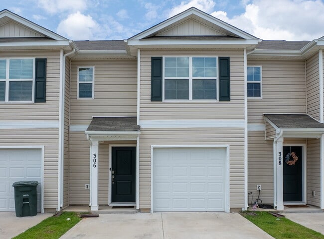 Building Photo - Partially furnished and now available!