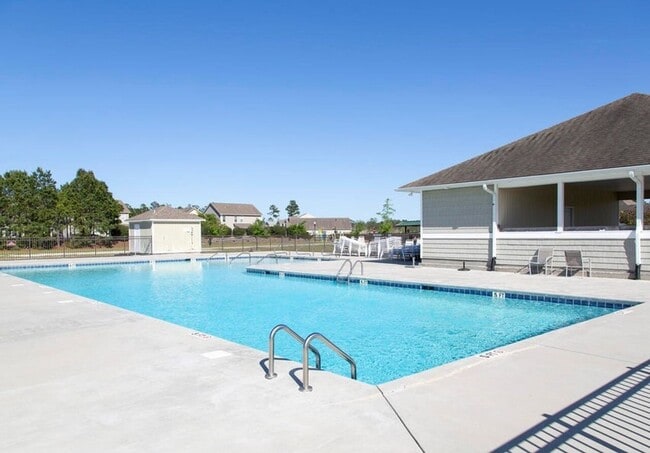 Building Photo - Welcome to this brand new end unit townhome that combines modern convenience with style and charm...