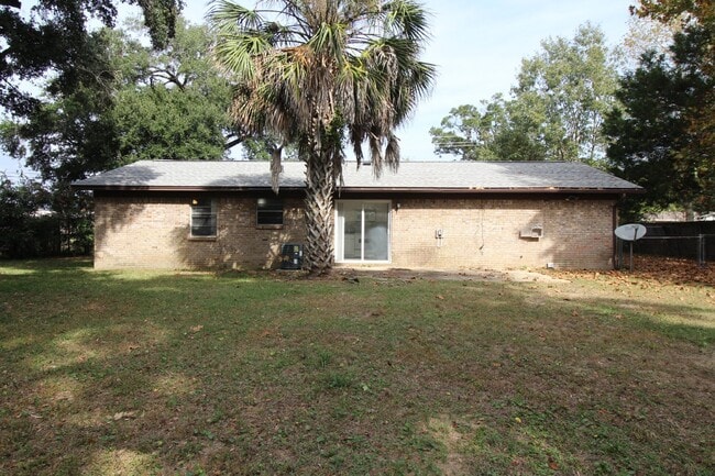Building Photo - Spacious 3BR/1.5BA Home in Pace with Open Living Area, Tiled Family Room, and Fenced Backyard – M...