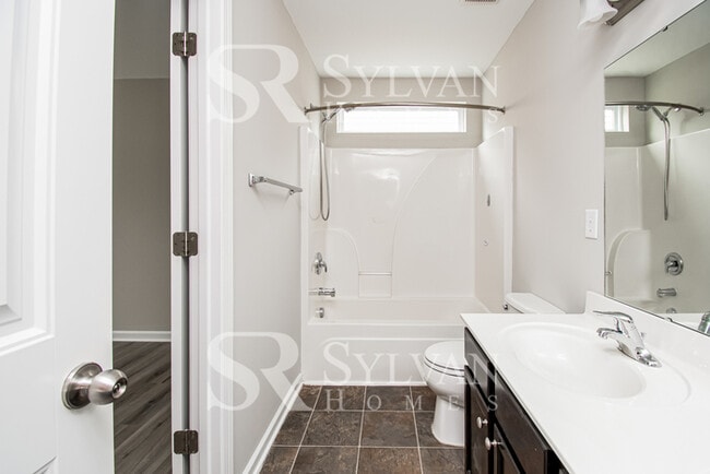 Building Photo - Feel welcome in this well-maintained 4BR 2...