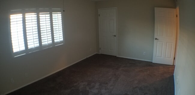 Master bedroom, with 2nd closet. NOTE: Carpet shown is not actual color. New carpet color is Steel - 14365 Foothill Blvd