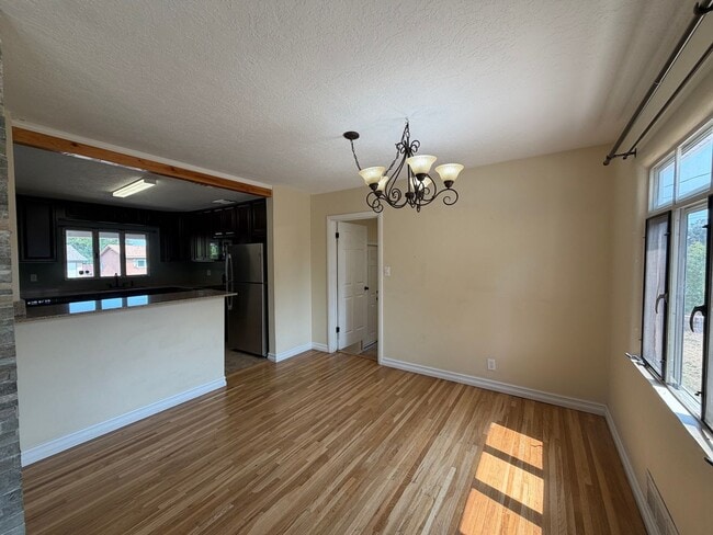 Building Photo - Spacious 4 Bedroom 2 Bathroom Home In The NE Heights!