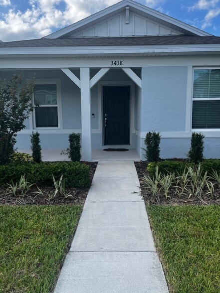 Front entrance and covered porch. - 3438 Orange Rose Loop