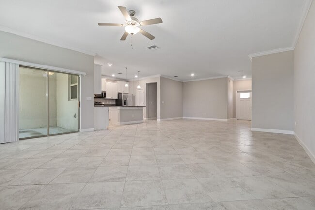Building Photo - "Spacious 4-Bed Oasis with Granite Charm in Lutz!"In a gated community with 2 Cars garage
