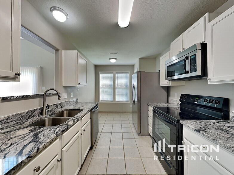 Building Photo - 9312 Tiger Lily Ln