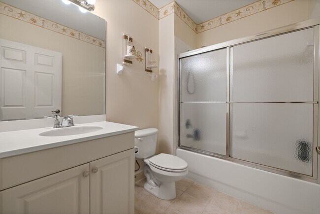 Building Photo - Experience Bell Tower Park. GATED ground floor 2 Bed 2 Bath Den 1 Car Garage Condo.