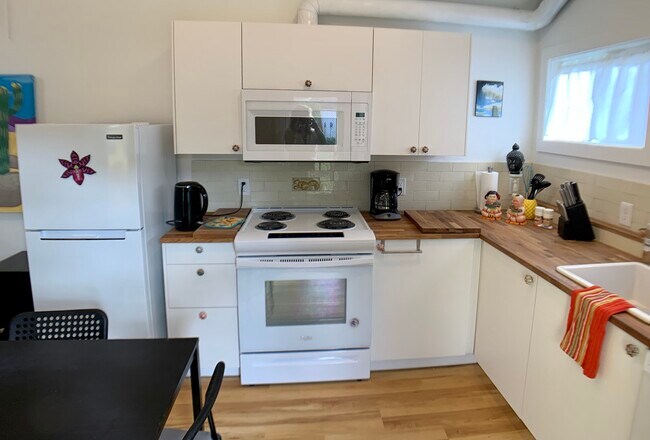 Full kitchen has everything you need to cook and serve 4 - 3405 NE 80th Ave