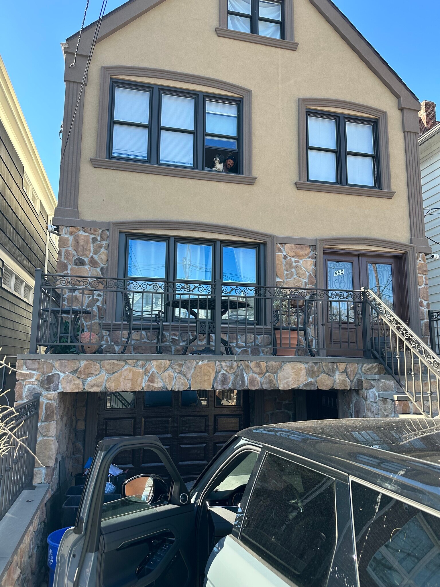 The exterior of the home with iron fencing for privacy and security - 859 Avenue C