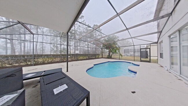 Building Photo - Spacious 6-Bedroom Pool Home with Open Floor Plan & Private Master Suite