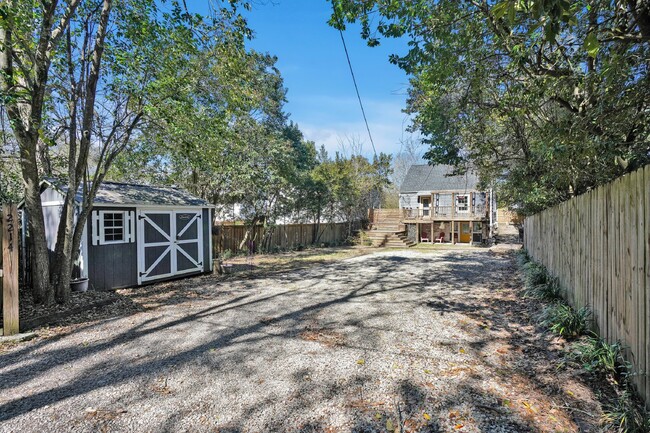 Building Photo - This charming cottage-style home has a lot...