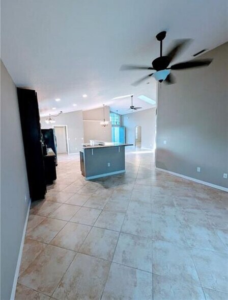 Living room view facing kitchen - 562 SW Saint Martins Cv