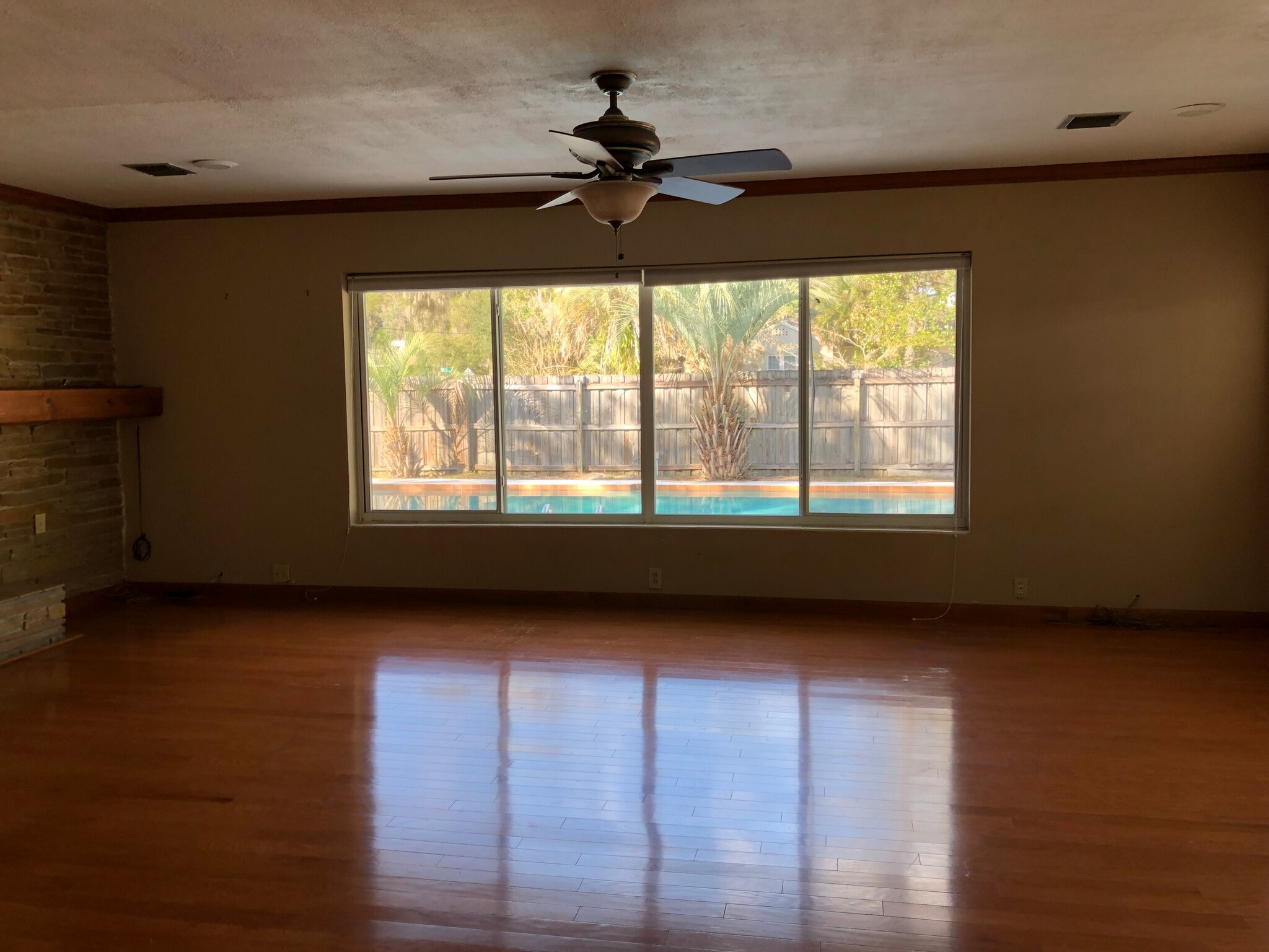 Living room with fire place overlooking the pool - 2156 NW 4th Pl
