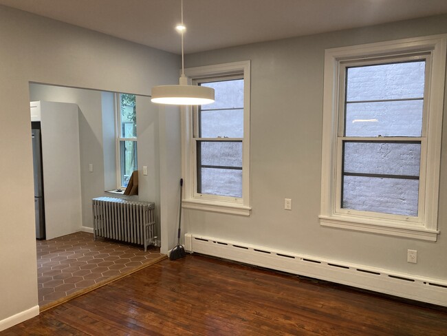 The well lit, large dining room offers built in storage, access to the basement and 2 large windows - 2621 E Somerset St