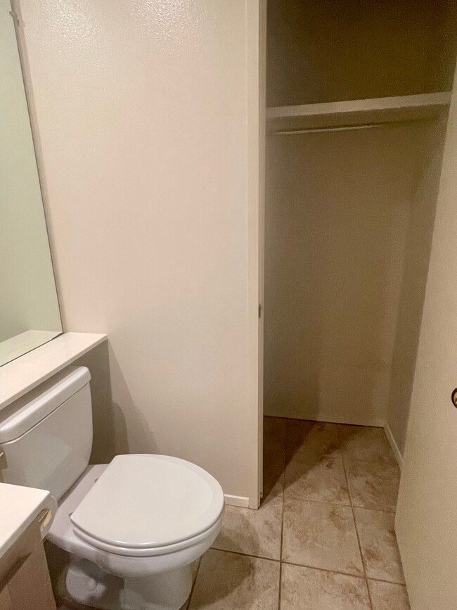1st floor bathroom with storage - 1915 Discovery Village Ln