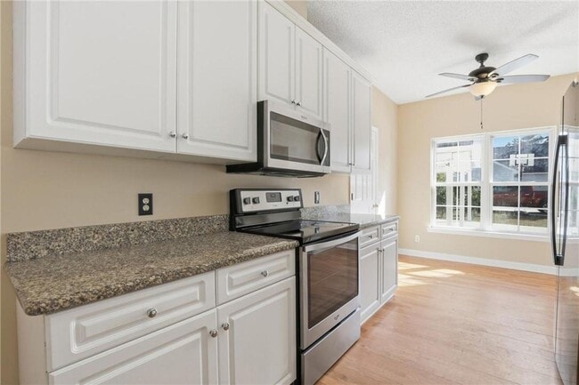 Building Photo - 4-Bedroom Home in Wild Heron with Front Porch and Fenced Yard