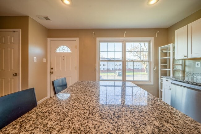 Building Photo - Spacious 3-Level Townhouse with Finished Basement and Fenced Patio