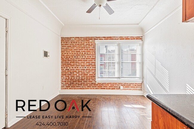 Building Photo - Stylish Studio with Exposed Red Brick, Min...