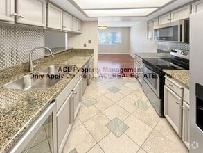 Building Photo - Bright 2BR/2BA Condo with Garage & Pool in...