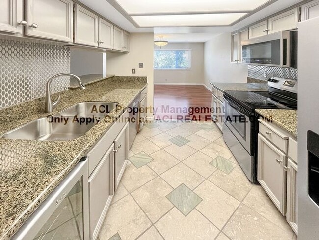 Primary Photo - Bright 2BR/2BA Condo with Garage & Pool in...