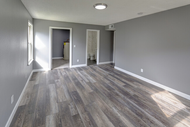 Master bedroom with ensuite bathroom and walk-in closet. - 499 Wright St